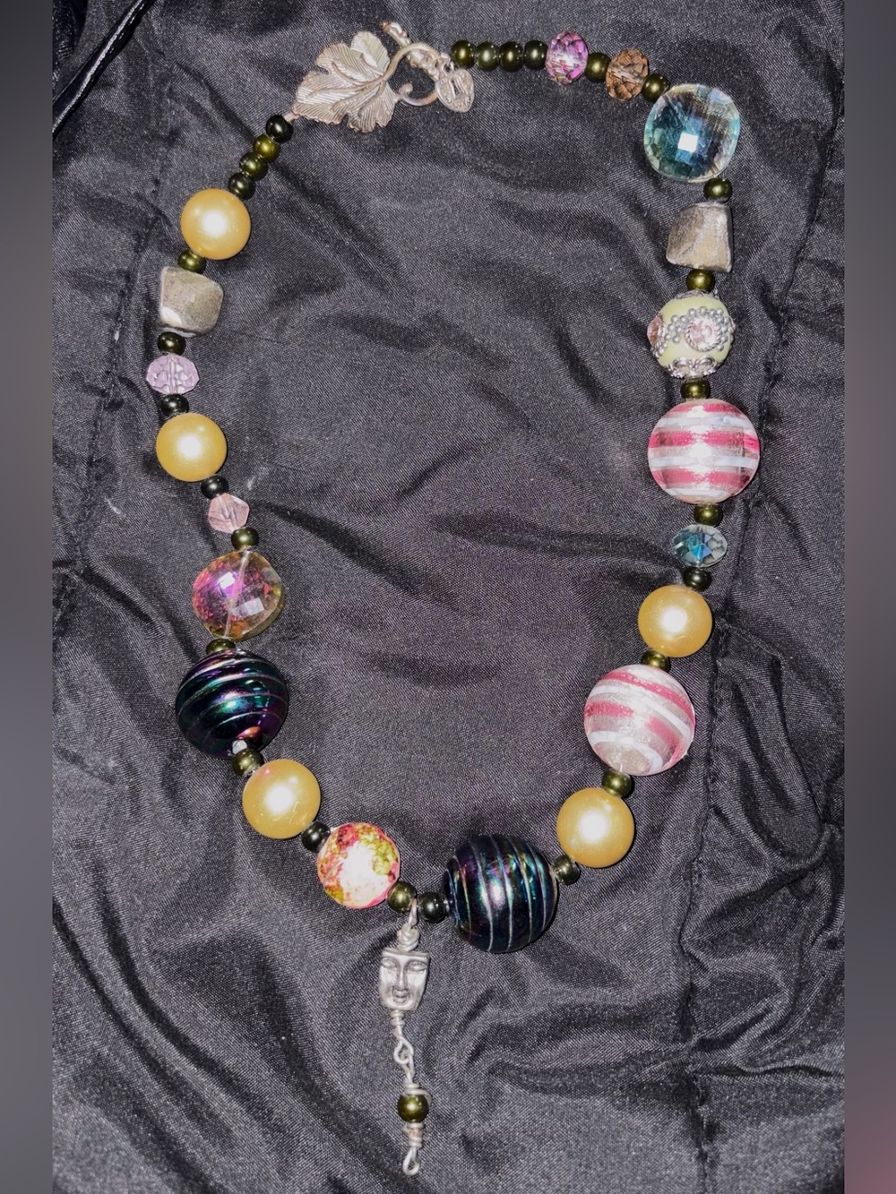 Multi-colored beaded necklace with assorted vintage glass, stone, metallic beads